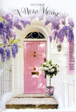 The scene unfolds like a storybook entrance somewhere in Maidenhead, perhaps echoing a tucked-away cottage near Braywick Park, where blossoms spill generously above a welcoming doorway. A pastel pink front door, lovingly painted in a soft, chalky hue, anchors the composition, its surface catching a warm, diffused light that smooths every edge and makes the threshold glow. Overhead, opulent wisteria tumbles in layered cascades, each strand a waterfall of lavender and lilac blossoms, dense yet airy, creating a natural canopy that frames the door in fragrant colour. The surrounding wall is whitewashed and slightly textured, with a matching blush-tinted shutter that subtly reflects the door's tone, tying the façade together in a calm, cohesive palette. At the base of the scene, a vintage-style grey tin bucket sits on the doorstep, sturdy and understated, acting as a quiet stage for a lush floral arrangement. It is filled to overflowing with velvety white and cream roses, the blooms generous, rounded, and fully open, as if caught at their most luxurious moment. Fine sprigs of soft green foliage weave gently between the petals, adding depth and a hint of garden freshness. Wrapped lovingly around the bucket, a soft pink ribbon has been tied in a simple but elegant bow, its satin finish lending a refined sheen that echoes the romance of the door and wisteria. The overall mood is tender and hopeful, reminiscent of a housewarming bouquet delivered by a caring local florist to a new home in the heart of Maidenhead-a floral embrace that quietly whispers congratulations, welcome, and the promise of happy days ahead.